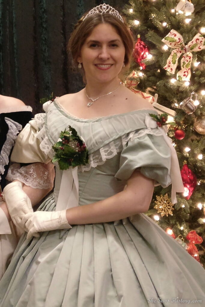 1860s Green silk satin Victorian Princess Ball Gown with Bertha and mistletoe for Christmas St Nicholas Ball
