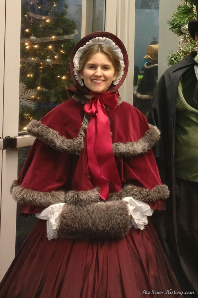 Charles Dickens Victorian Caroling Dress with bonnet, muff and cape